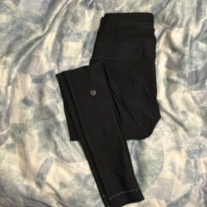 Lululemon workout black pants, with zipper pocket in back.